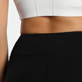 close up view for back view of woman wearing legging black with bra 