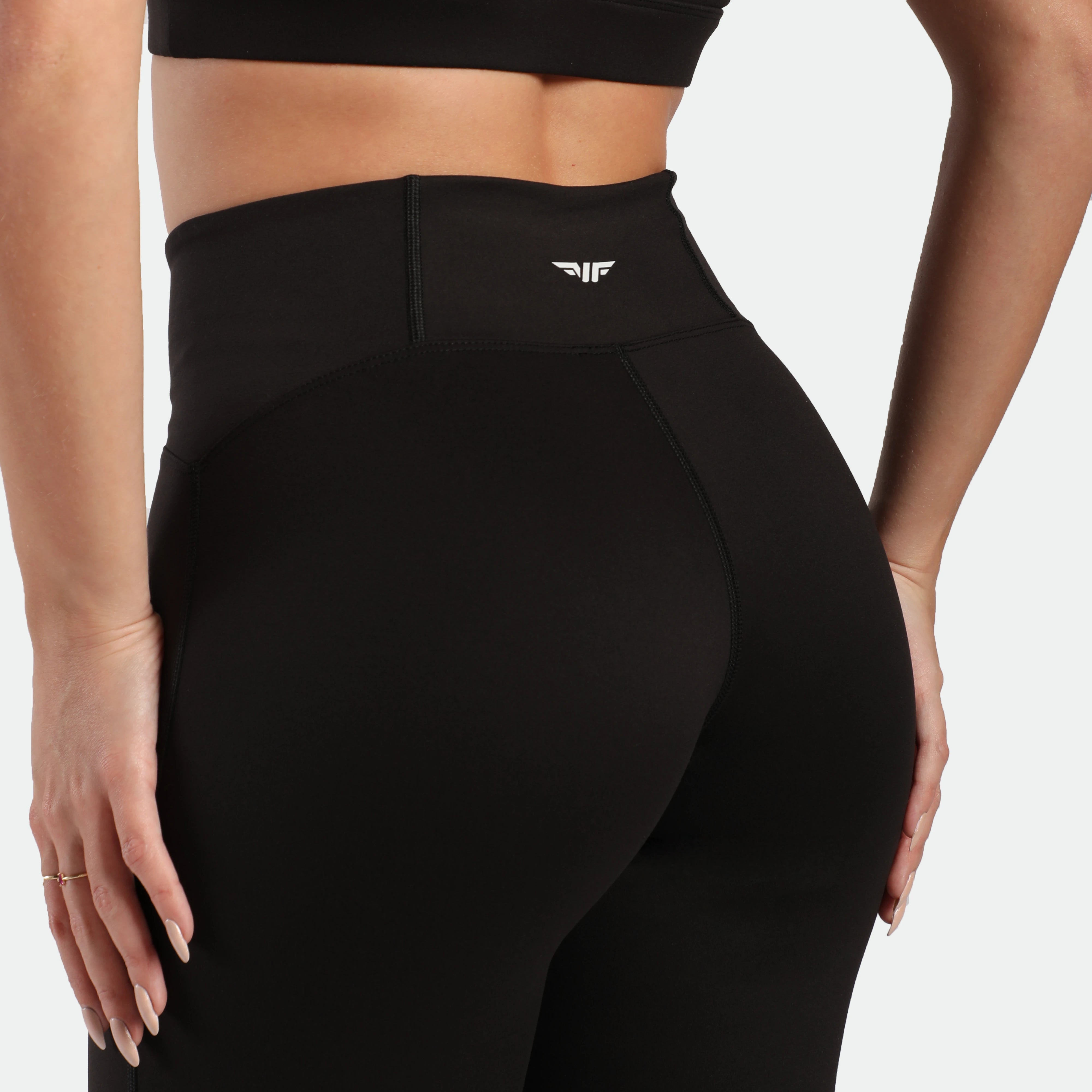 close up view for back view of woman wearing bra and legging black 