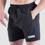 close up view for fit man wearing short black with logo 