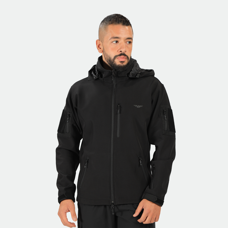 a fit man wearing a polo jacket black with much zipper and logo ,plus the pants 