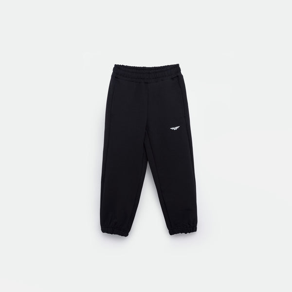 black JOGGER PANT FOR GIRL with an elastic waistband and cuffs, featuring a small white logo (WINNER FORCE) on the left thigh