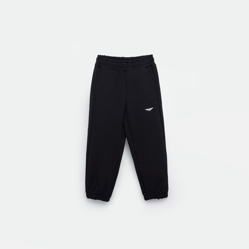 black JOGGER PANT FOR GIRL with an elastic waistband and cuffs, featuring a small white logo (WINNER FORCE) on the left thigh