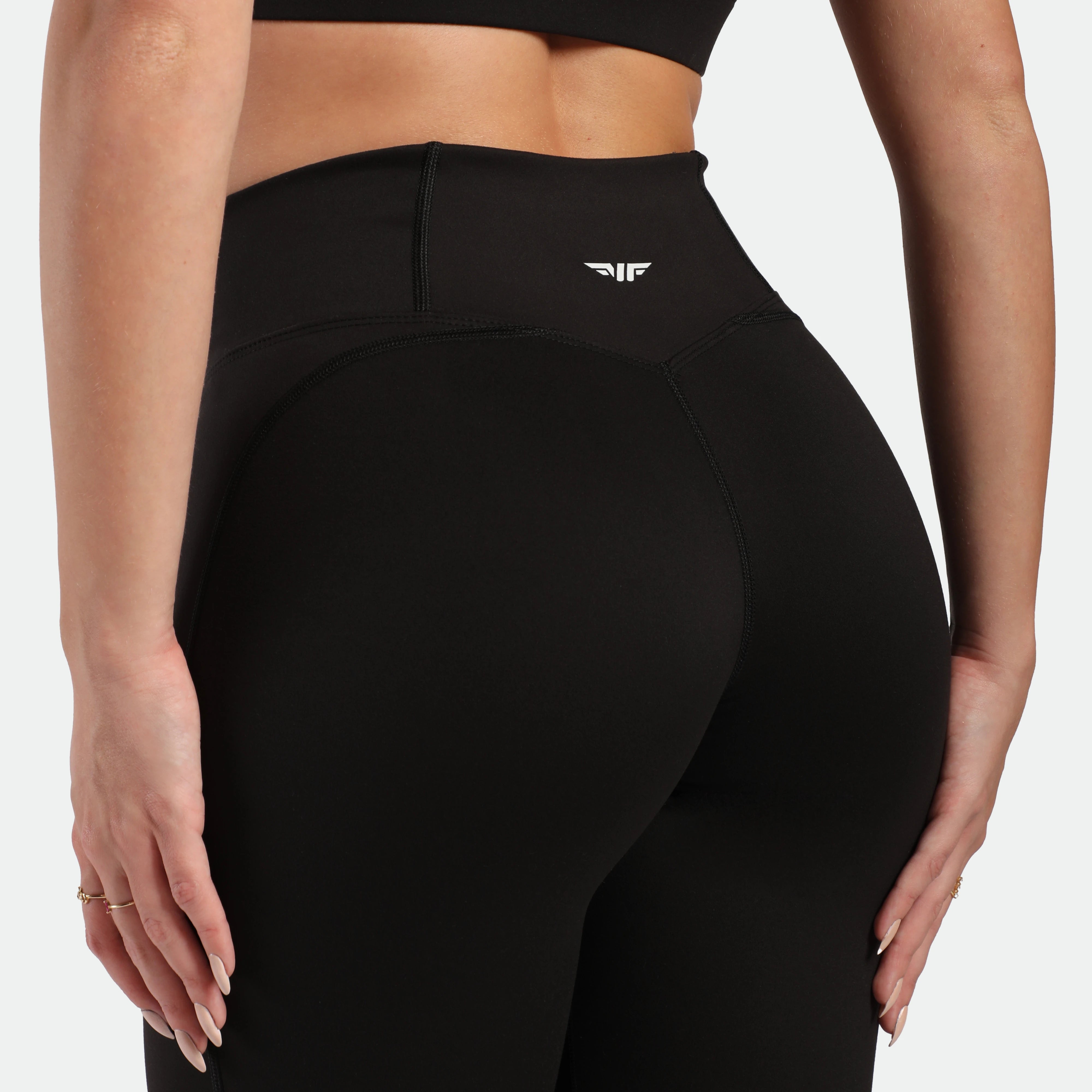 Black leggings with a brand logo on a white background