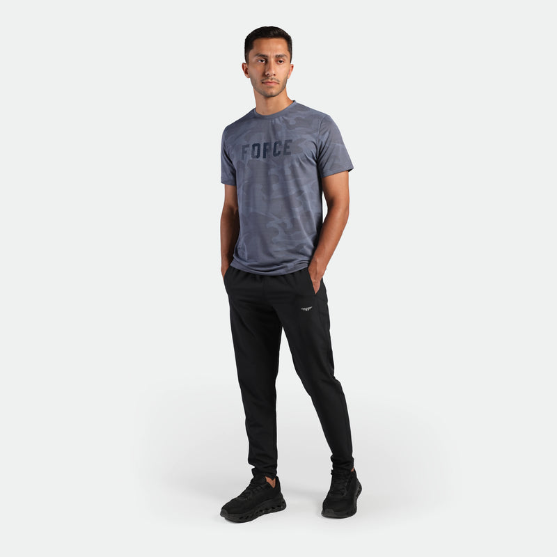 a fit man wearing t-shirt blue with pants black plus the shoes black 