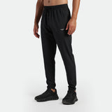 a fit man wearing pants black with shoes black 