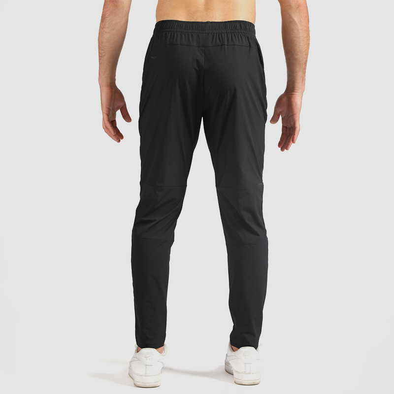a back view for fit man wearing pants black with shoes 