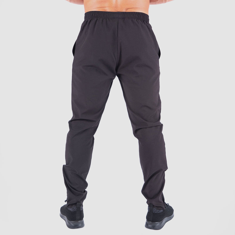 a back view for fit man wearing pants  black with shoes black 