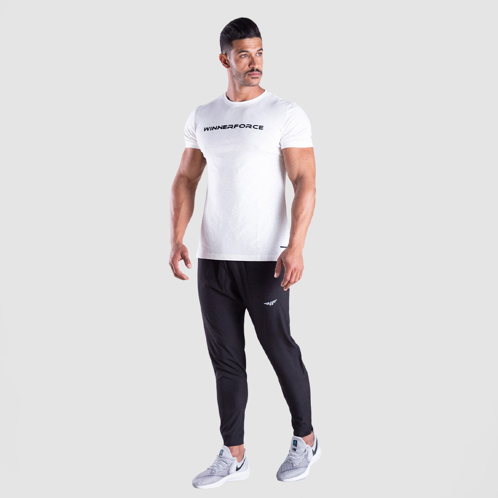 a fit man wearing t-shirt white with logo and he wearing  pants grey with shoes 