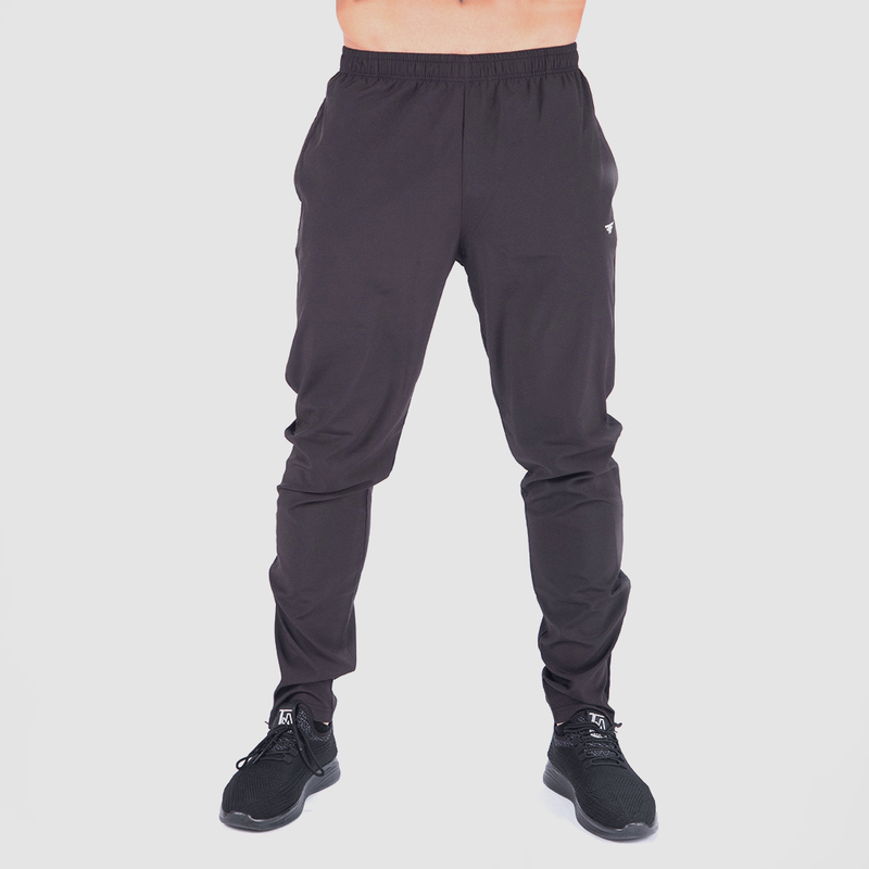 a fit man wearing  pants  black with shoes black 