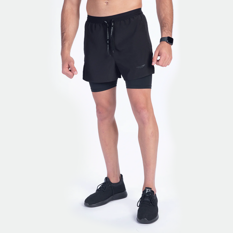 a fit man wearing short black 2 in 1 with shoes black 