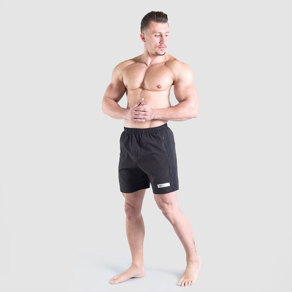 a fit man wearing short black with logo 