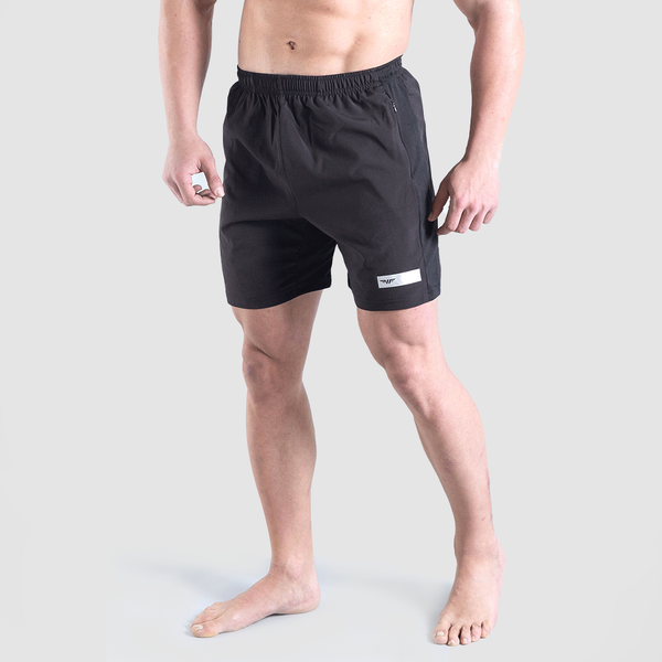 a fit man wearing short black with logo 
