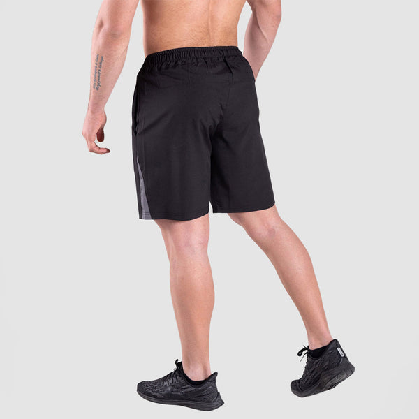 a back view for fit man wearing short  black with shoes black 