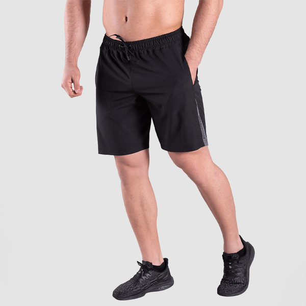 a fit man wearing short back with shoes black 