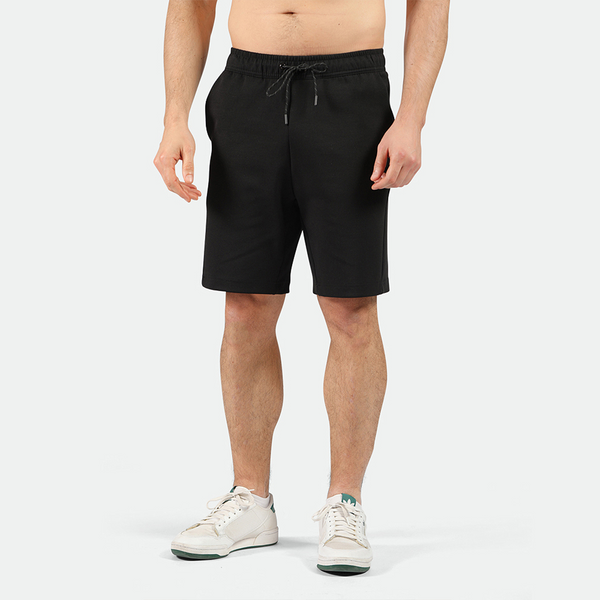 a fit man wearing short black with shoes 