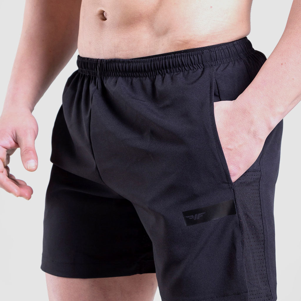 close up view for fit man wearing short black vimaxo 