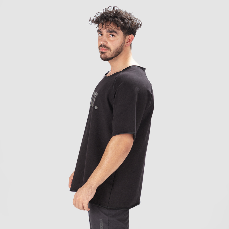 a fit man stand at right and wearing t-shirt black ,and pants black 