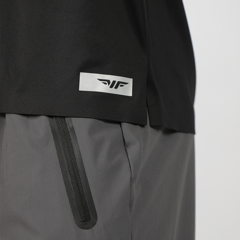 close up view of  logo for t-shirt black with zipper of pants grey 