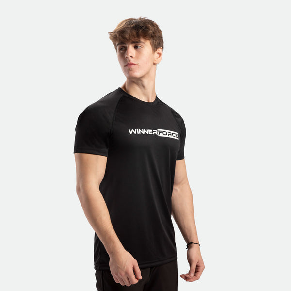 a fit man stand at right and wearing t-shirt black with logo ,plus he wearing pants black 