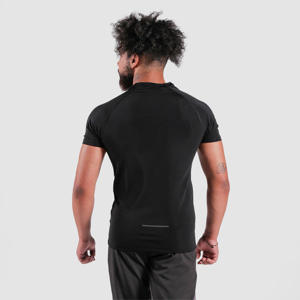 a back view for fit man wearing t-shirt black with pants grey 