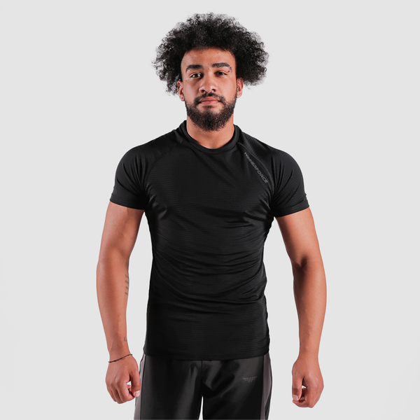 a fit man wearing t-shirt black with pants grey 