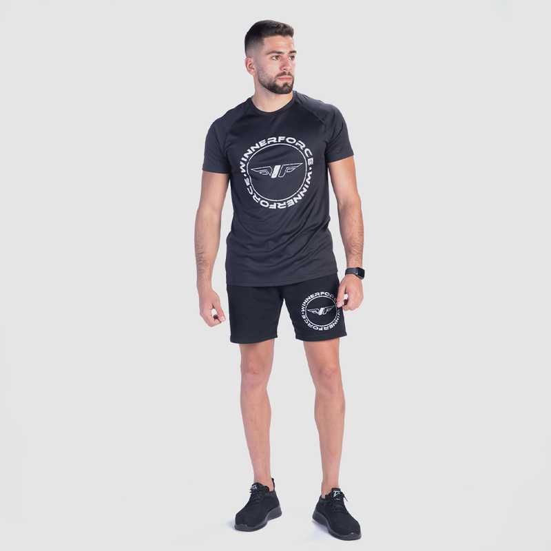 a fit man wearing matching set with logo ,t-shirt with short ,plus the shoes black 