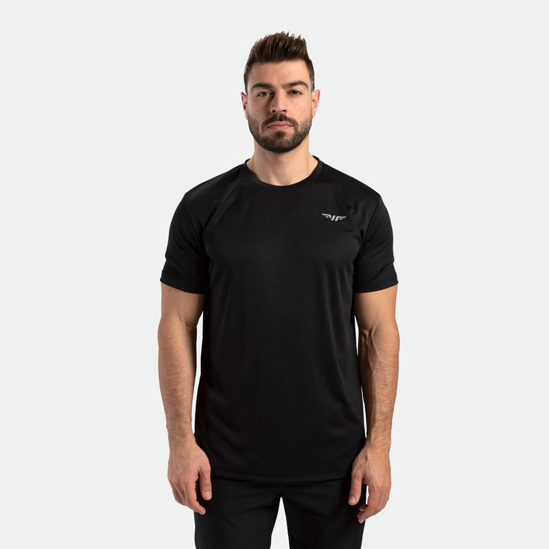 a fit man wearing matching color set ,t-shirt with logo and pants 