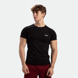 a fit man wearing t-shirt black with pants red 