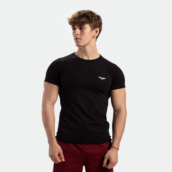 a fit man wearing t-shirt black with pants red 