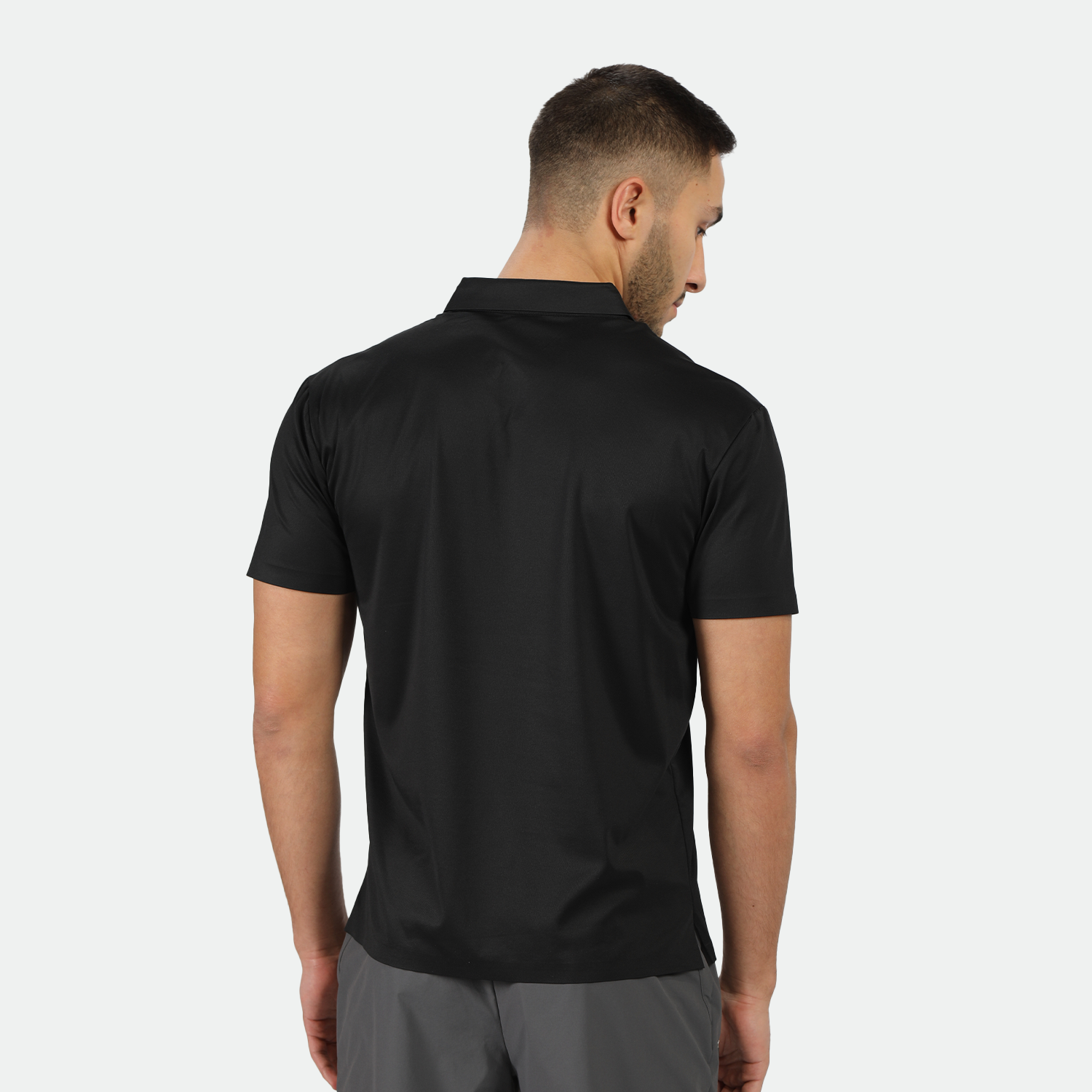a back view for fit man wearing  t-shirt back with pants  grey 