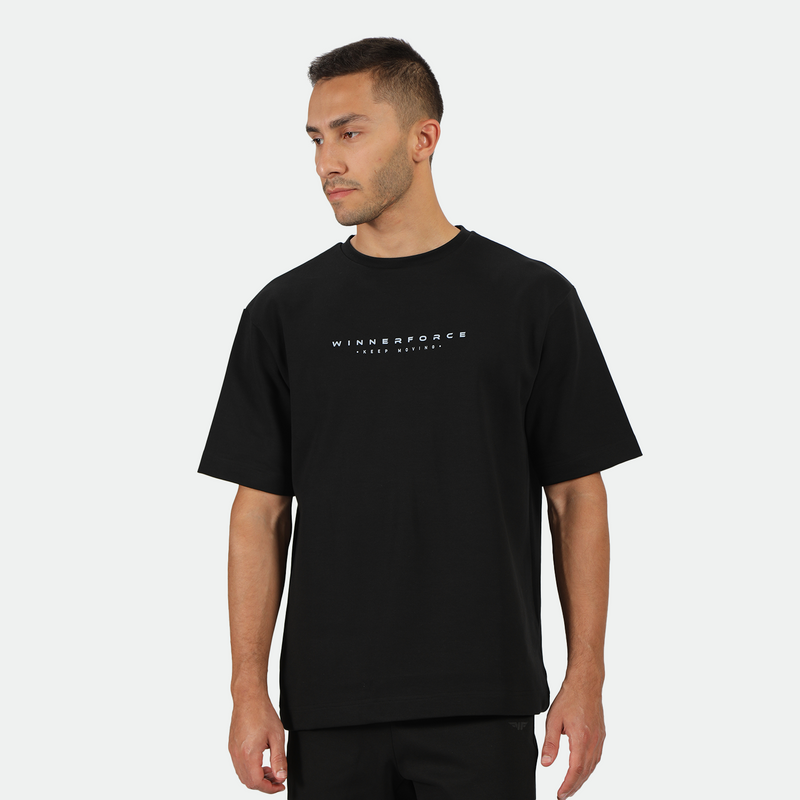 a fit man wearing matching set color back ,t-shirt black with logo and short  