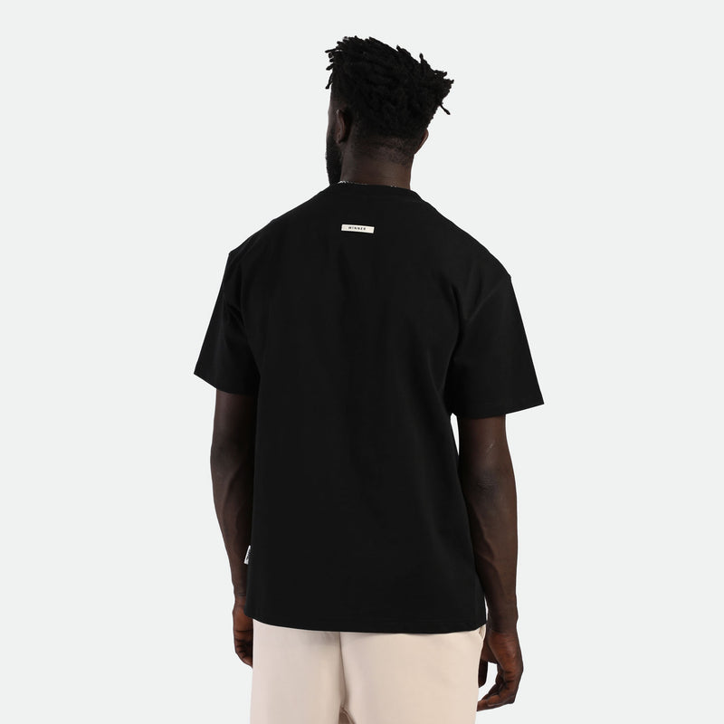 a back view for fit man wearing t-shirt beige with short beige 