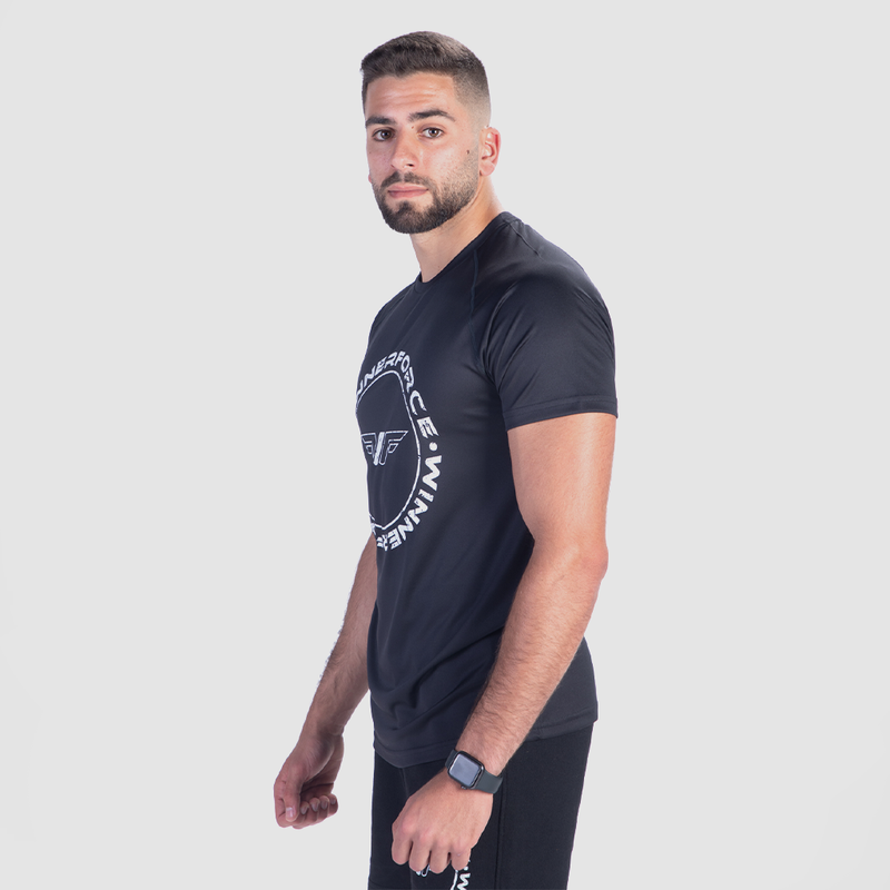 a fit man  stand at right and wearing t-shirt black with logo and pants 