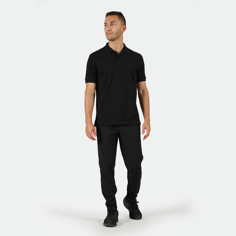 a fit man wearing matching set color ,t-shirt and shoes black 