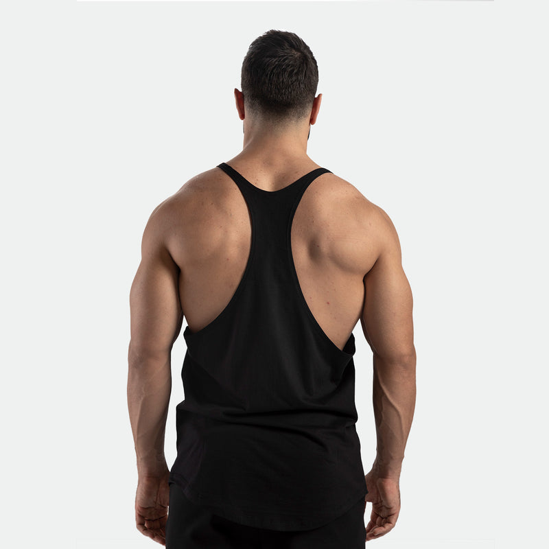 a back view for fit man wearing tank black with pants black 