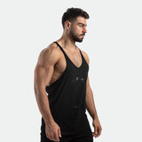 a fit man wearing tank black with pants black 