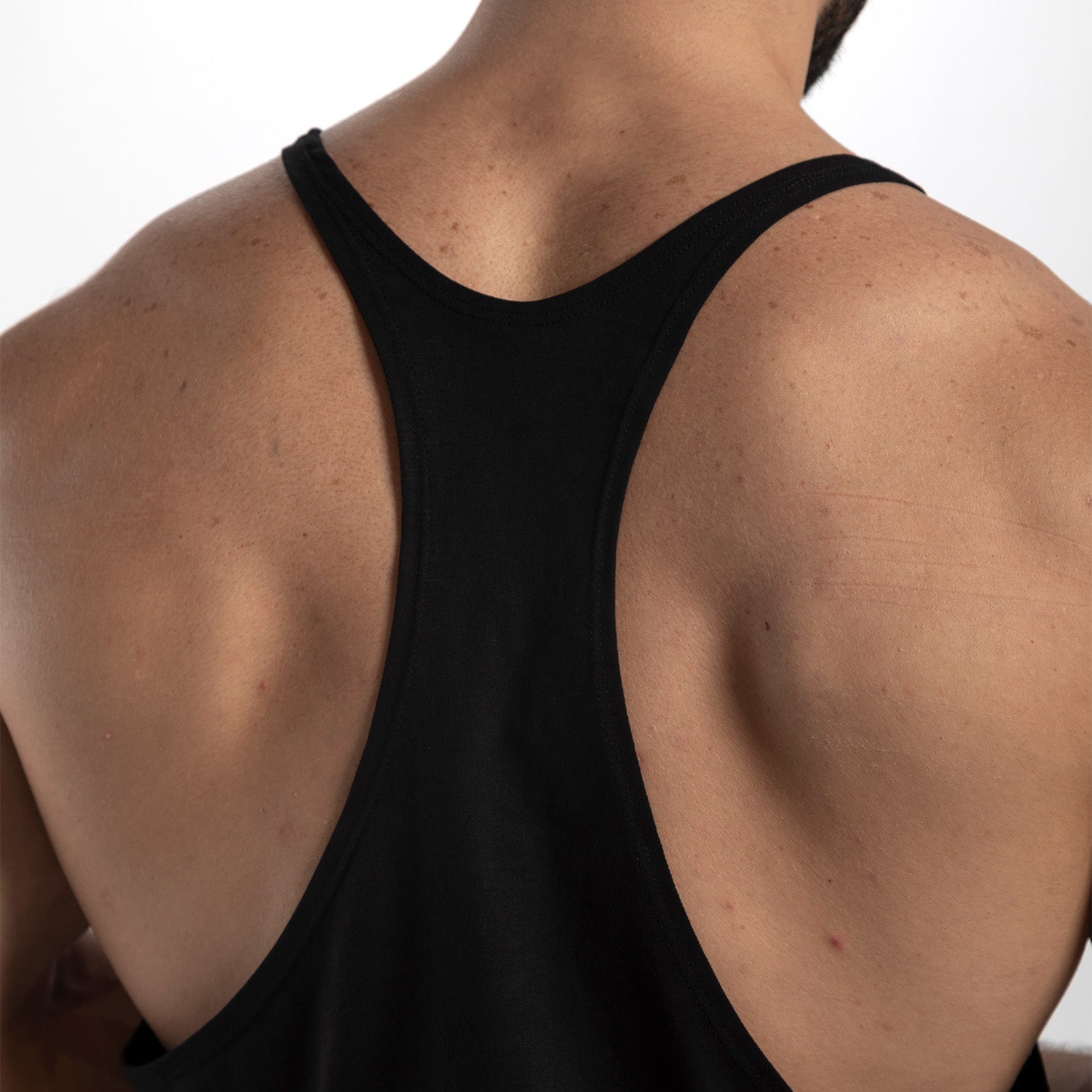 a back view for fit man wearing tank black 