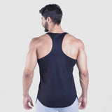 a back view for fit man wearing tank  black with pants light grey 