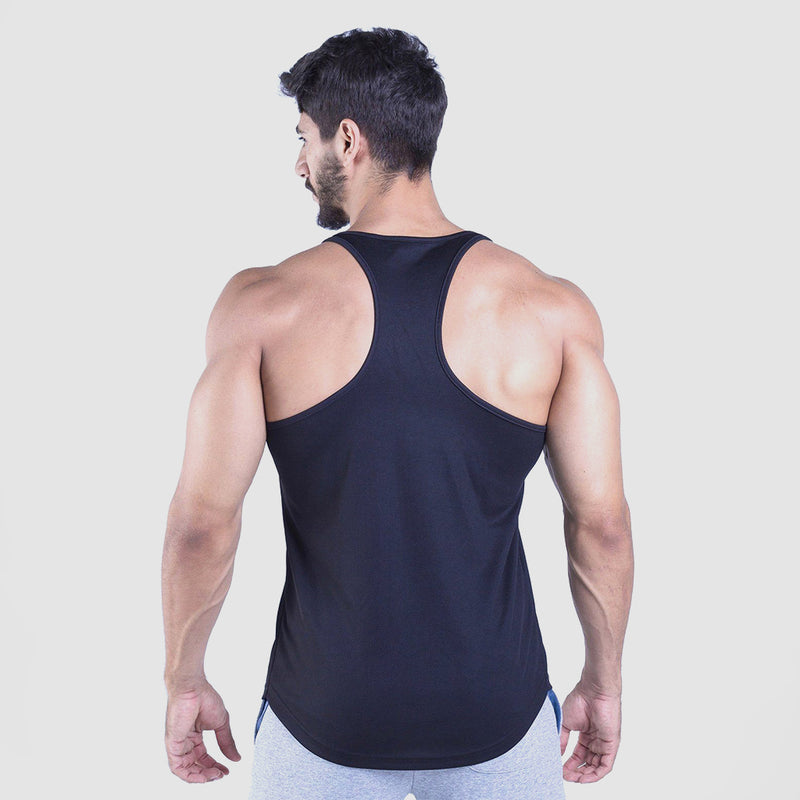 a back view for fit man wearing tank  black with pants light grey 