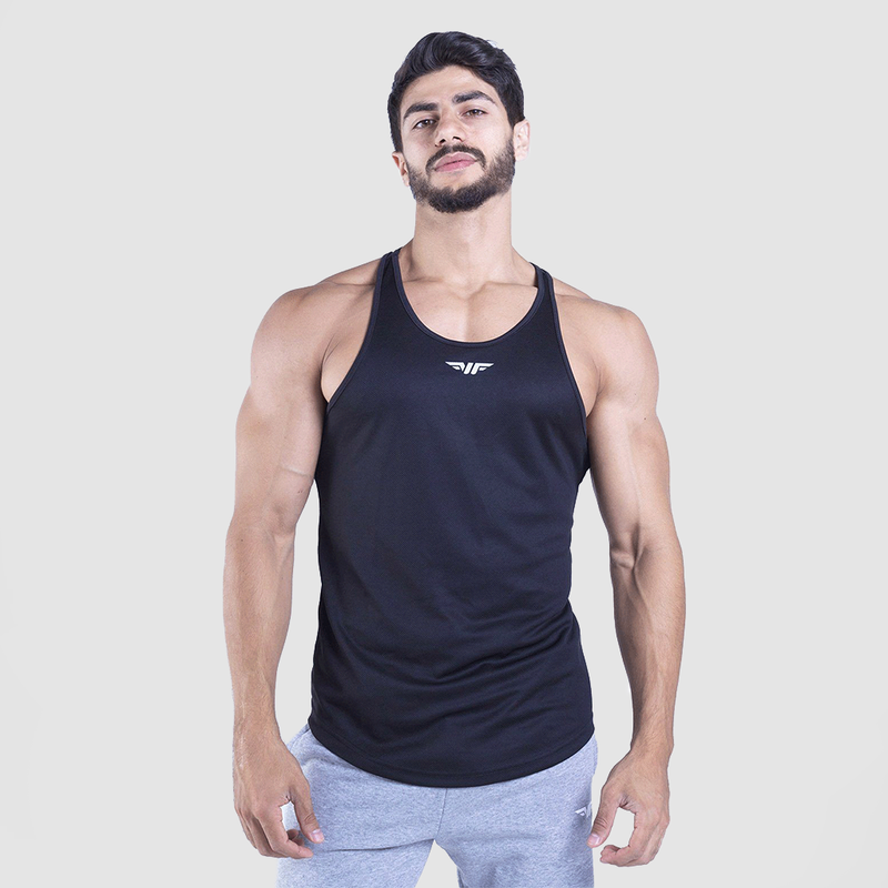a fit man wearing tank  black with logo  in half and wearing pants light grey 
