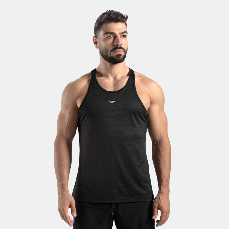a fit man wearing tank camo black with logo in half and pants black 