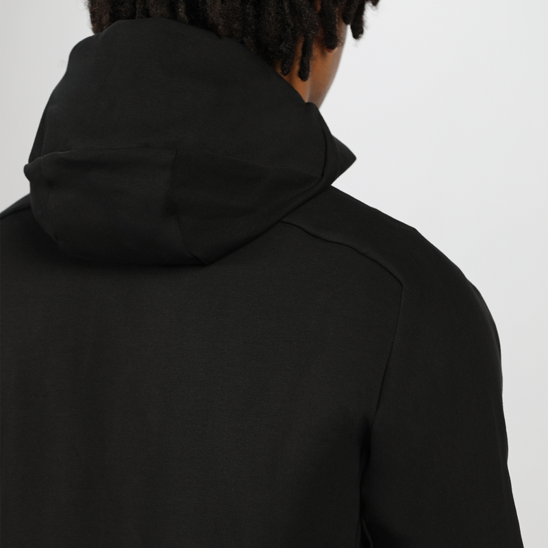 a back view for fit man wearing tech zipped hoodie black 