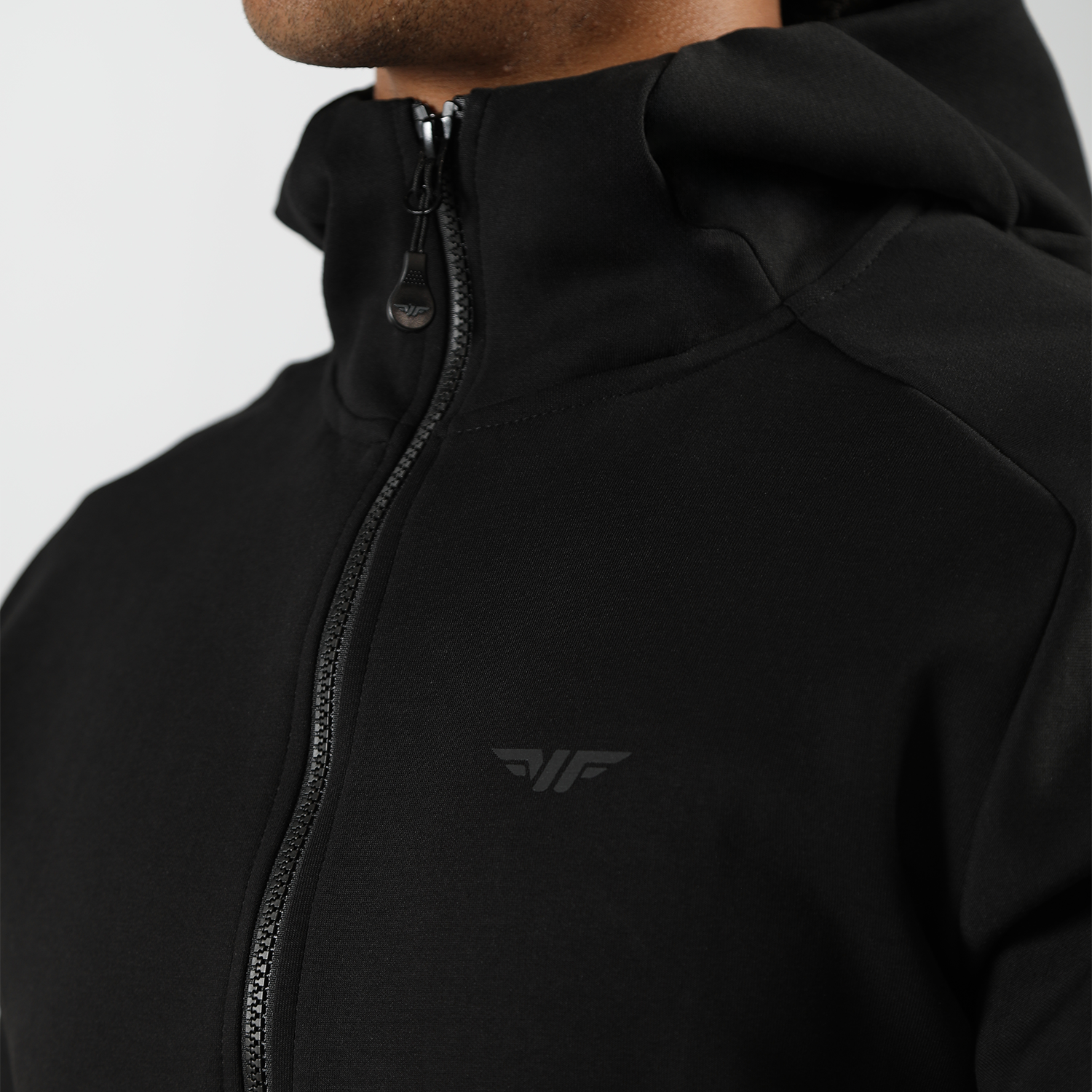 close up view for tech zipped hoodie   black with logo 