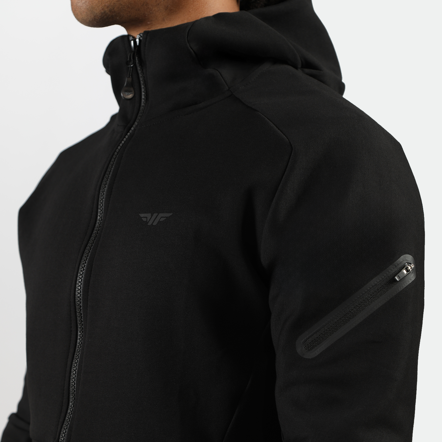 close up view for fit man wearing tech zipped hoodie black with logo 