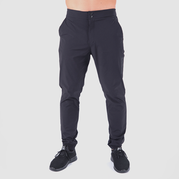a fit man wearing pants black with shoes black 