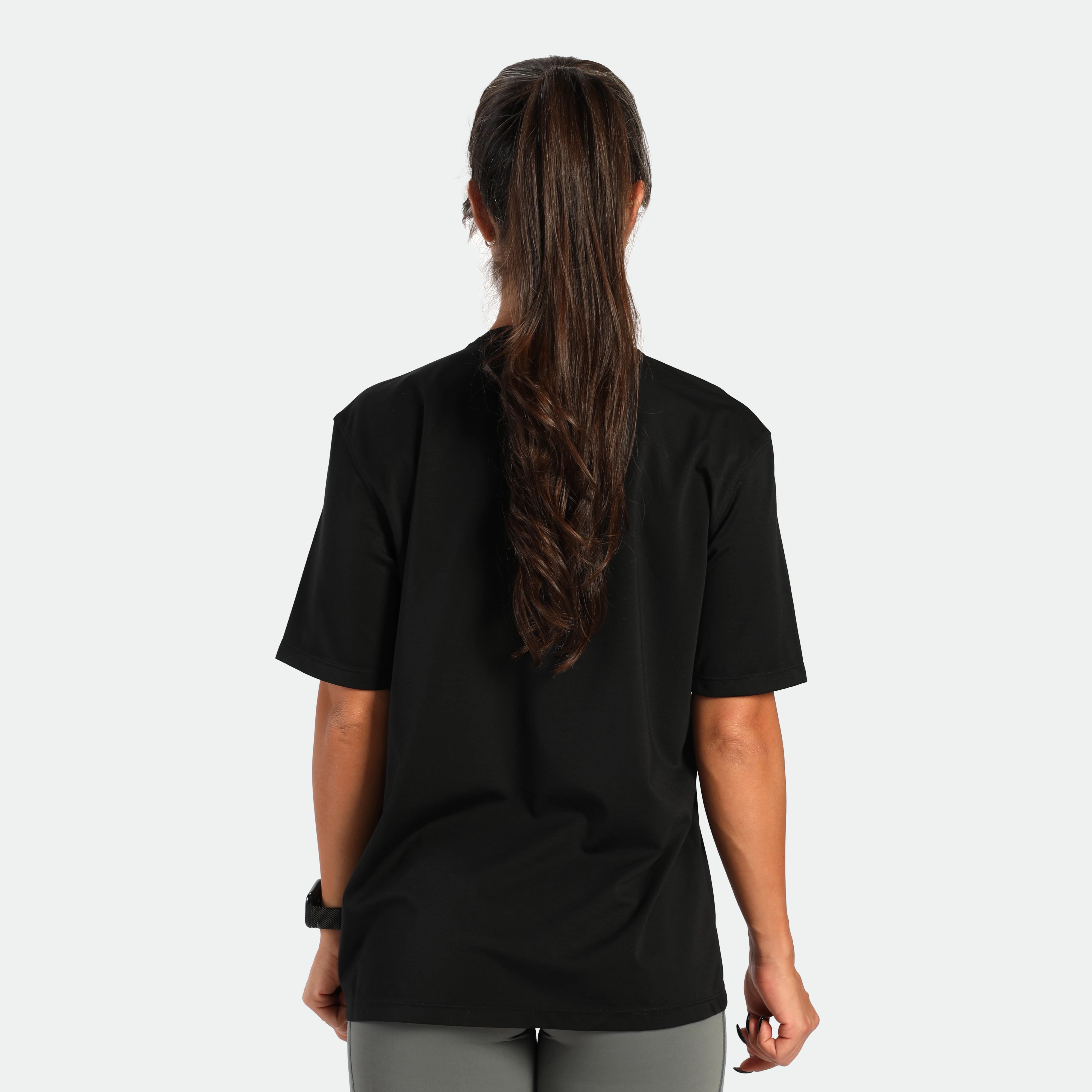 a back view for fit woman wearing t-shirt black with short   sage grey 