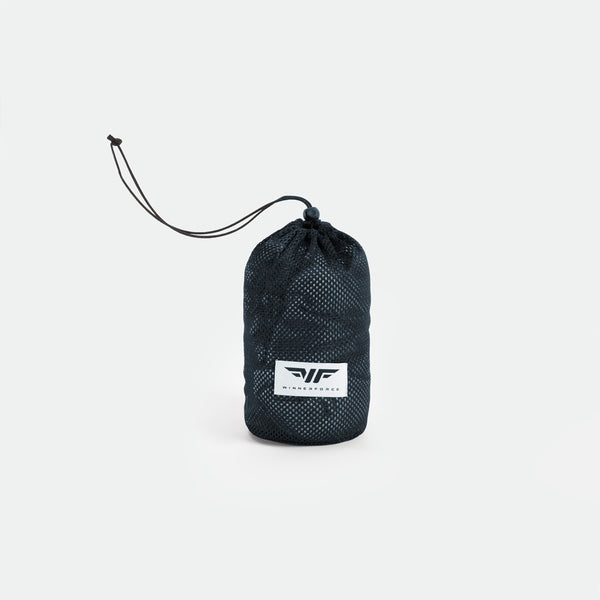 Black mesh drawstring bag with a logo on the front, set against a white background. The bag is cylindrical, compact, and neatly closed.