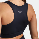 close up view for fit woman wearing bra navy blue with logo 