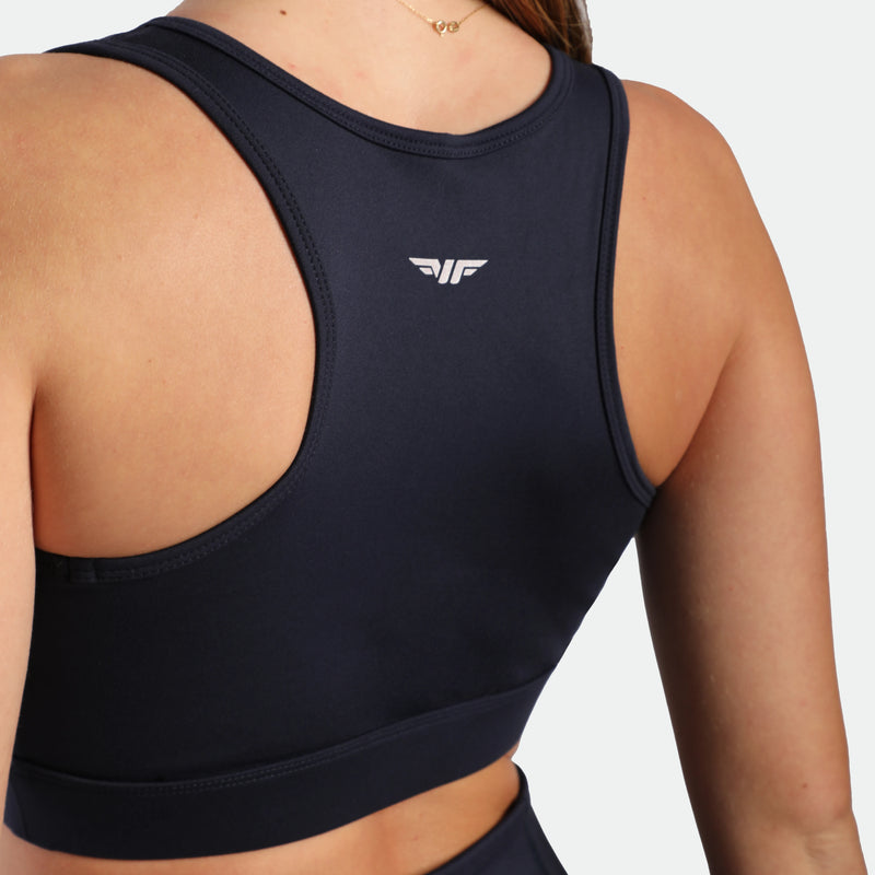 close up view for fit woman wearing bra navy blue with logo 