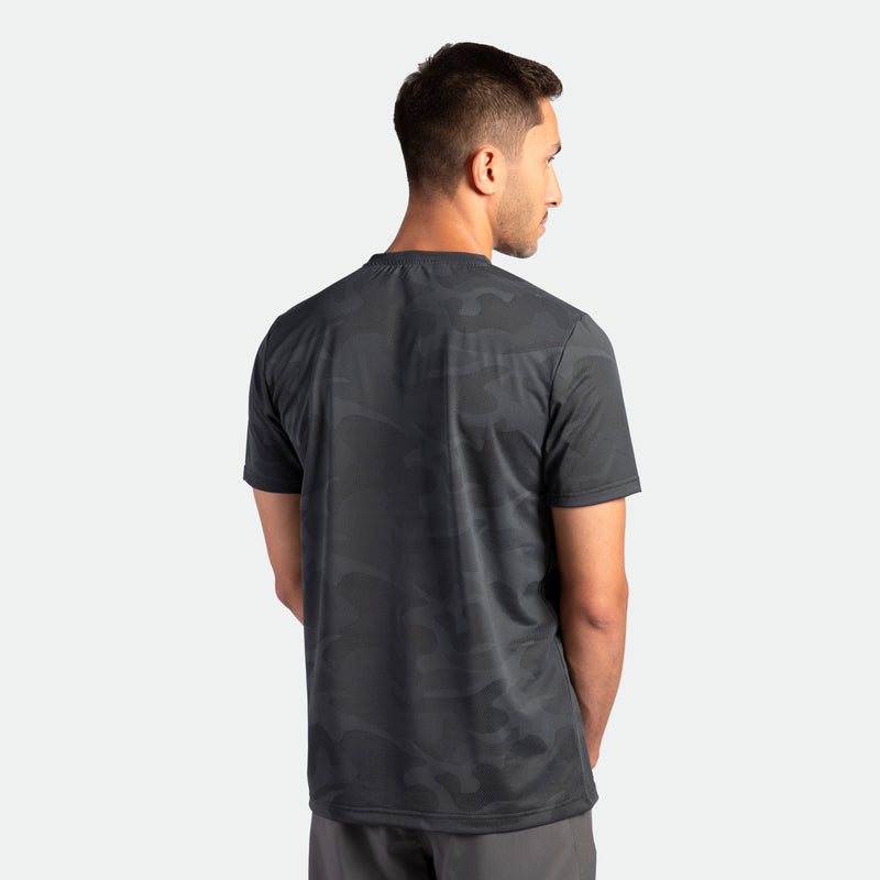 a back view for fit man wearing t-shirt camo graphite blue with pants grey 